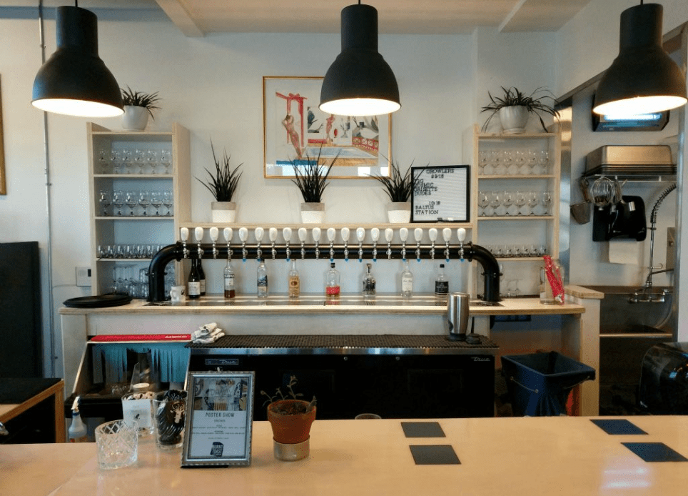 Modern bar interior with hanging lights.
